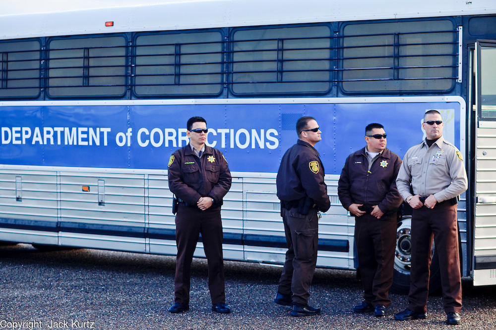 28 JANUARY 2010 -- BUCKEYE, AZ: Arizona Department of Corrections officers wait for federal authorities to show up to take control of 51 ADoC inmates. The Arizona Department of Corrections transferred 51 inmates from state control to the Immigration and Customs Enforcement at Lewis Prison in Buckeye Thursday morning. The inmates have less than 90 days left on their sentences and will be deported to their countries of origin when they finish their prison terms.  PHOTO BY JACK KURTZ